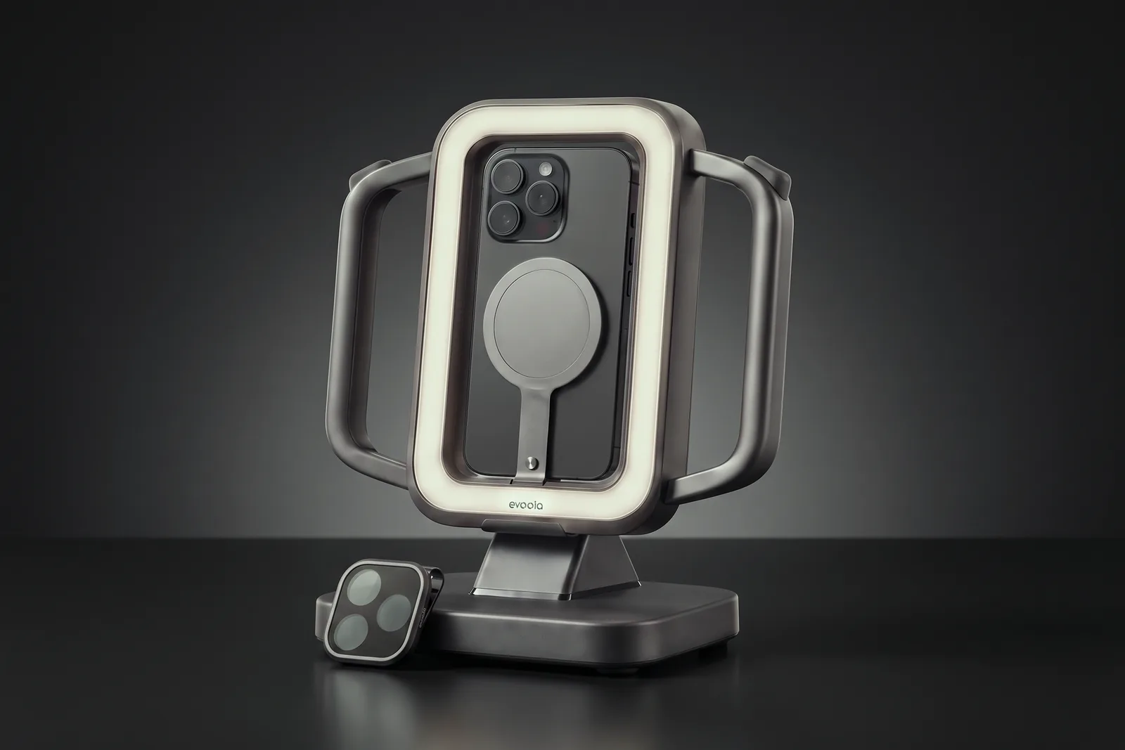 evooia Light Pro on its stand, with the lens filter from the filter set beside the base